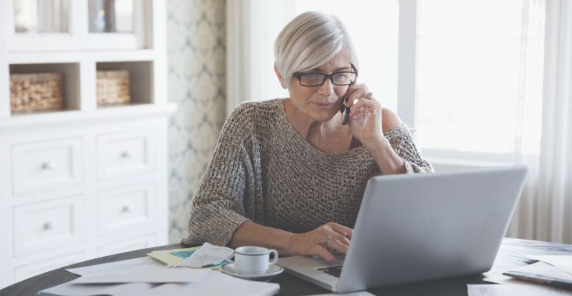 Looking at laptop and attending call