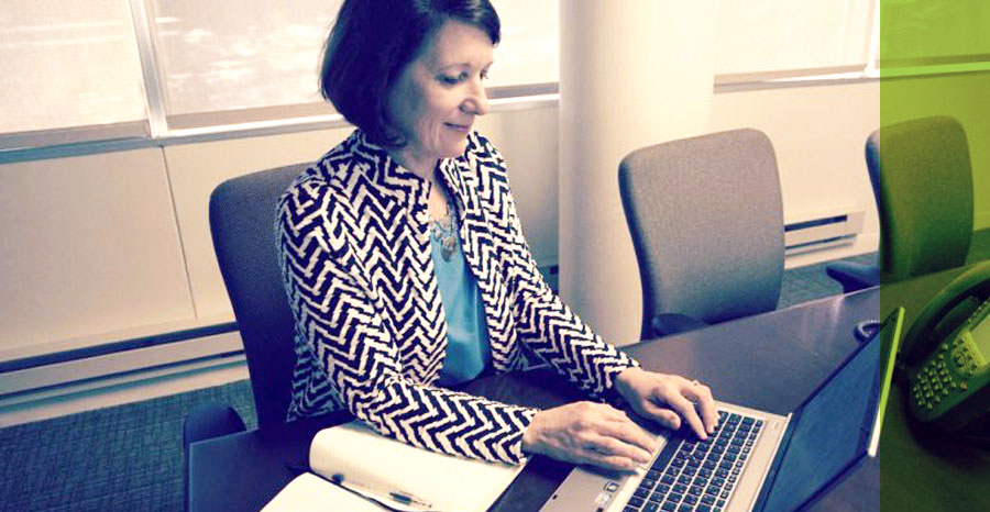woman working with a Laptop in her office