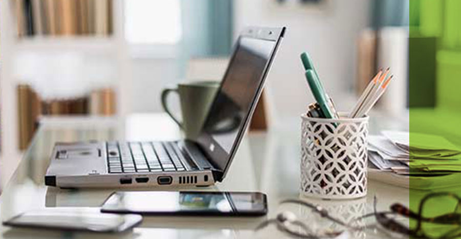 work station desk with laptop , and other work utilities