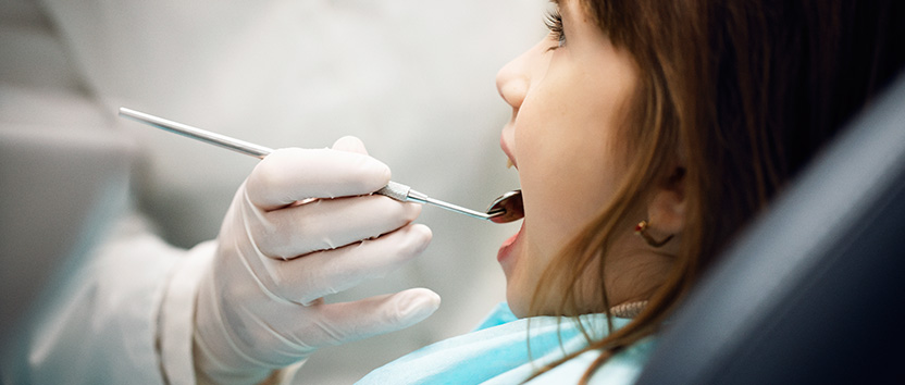 Little girl undergoing a dental check up