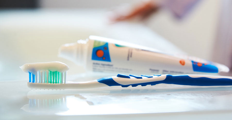 Father and son brushing teeth