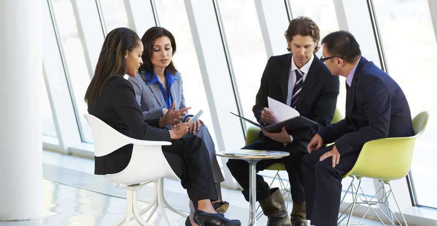 meeting by a wall of windows