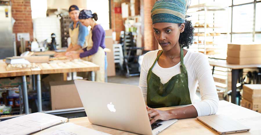 woman working with a Laptop in her office