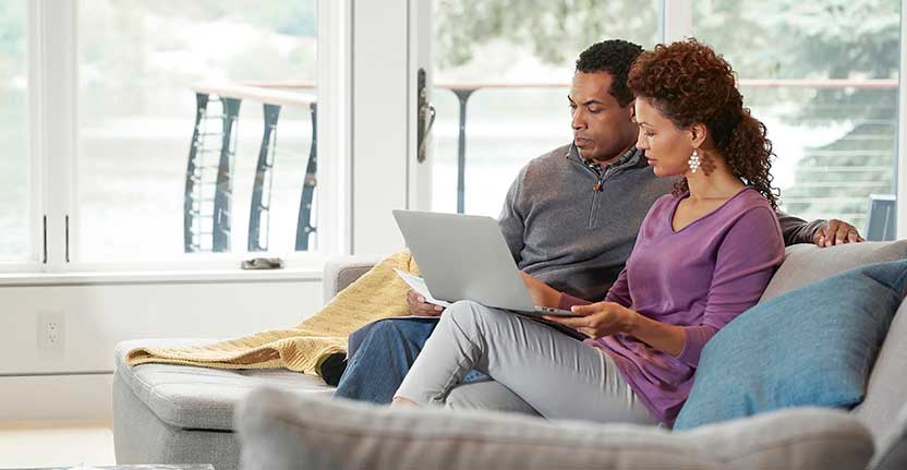 Couple using laptop