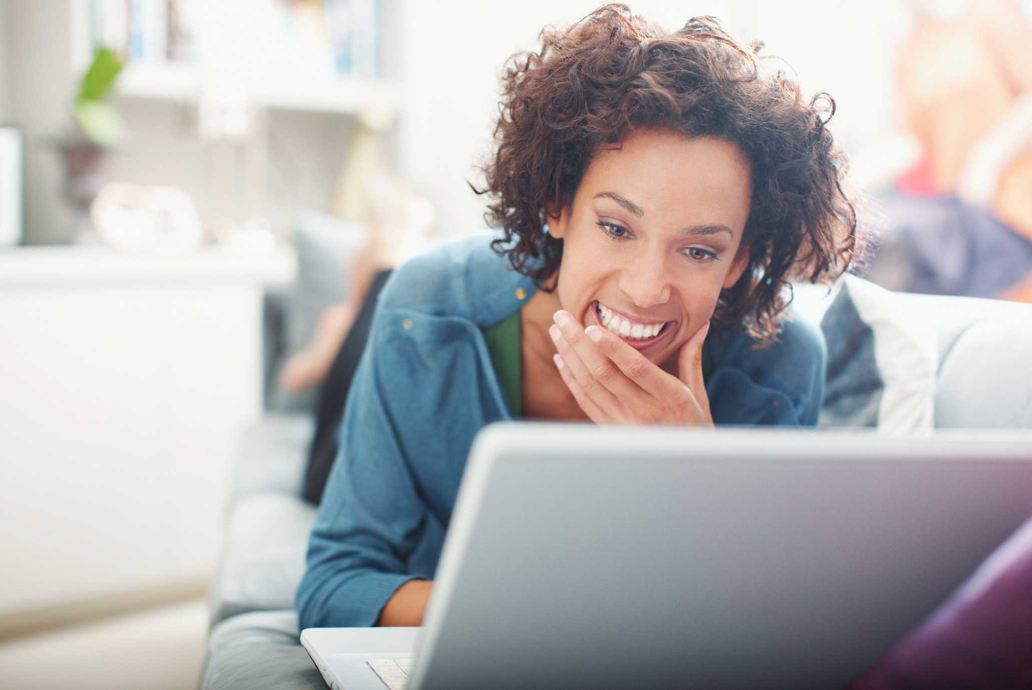 Women relaxing and working on a laptop