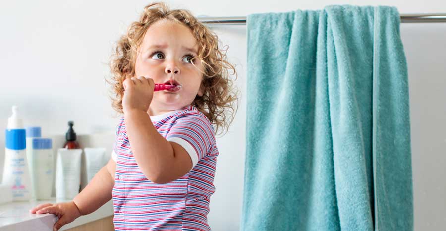 Girl brushing her teeth