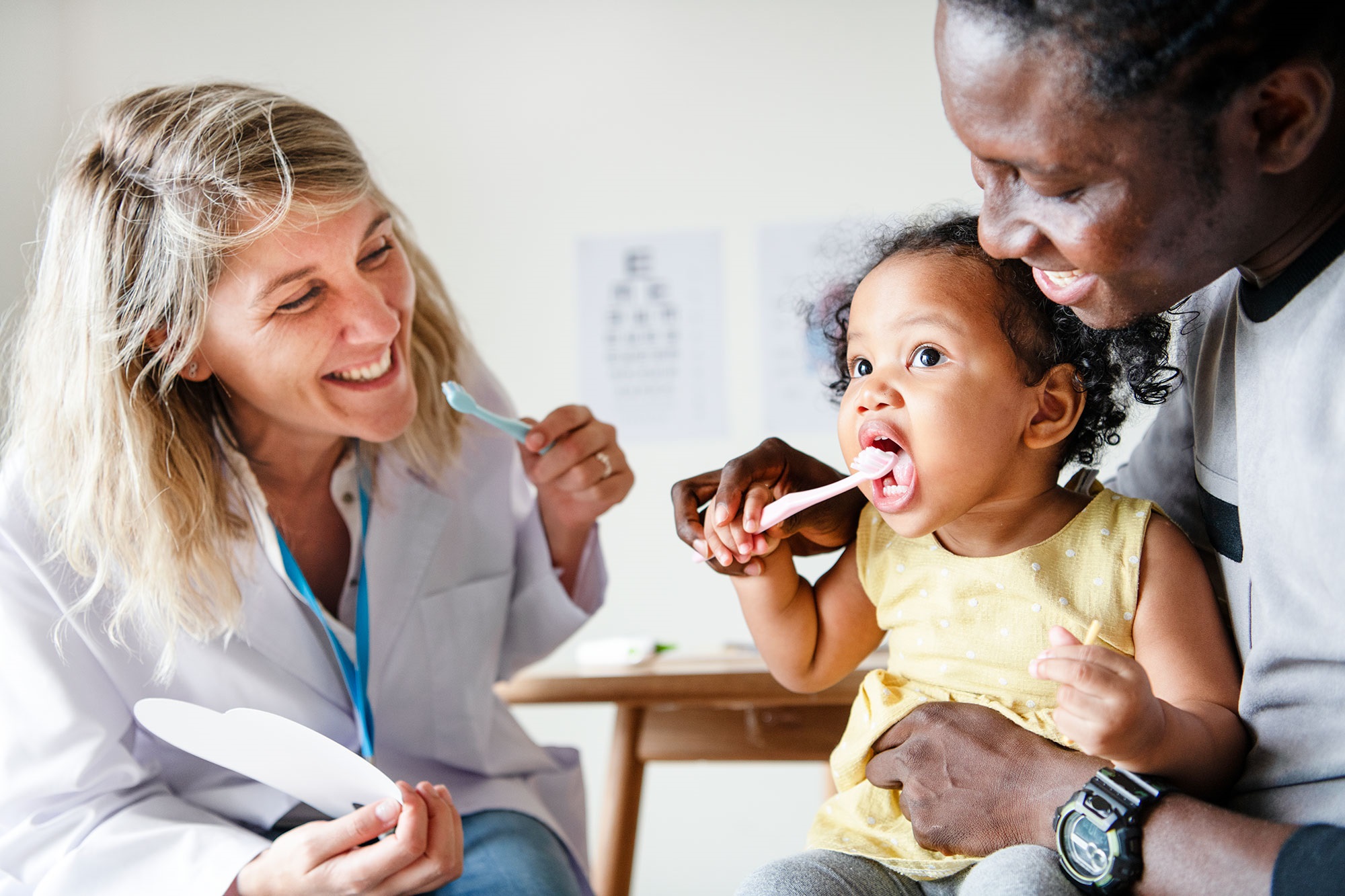 Dentist, baby and dad