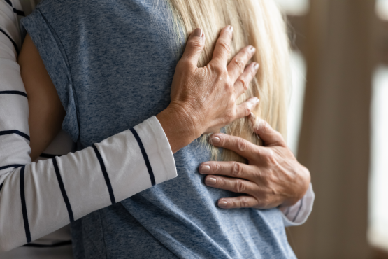 Elderly woman hugging