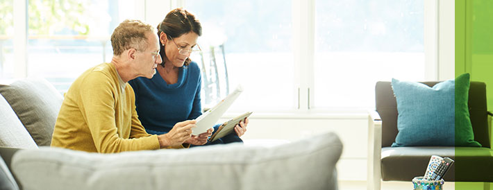 Elderly couple discussing on plans